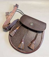 Front view of leather sporran with strap attached