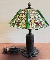 Front view of stained glass table lamp, cord visible