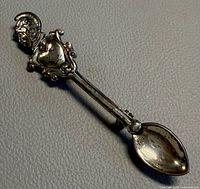Full view of spoon-shaped sterling brooch