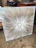 Front view showing entire abstract starburst design on square canvas