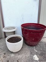 front view of three planters showing sizes and colors