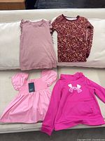 All four garments laid out on couch