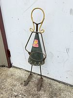 Full view of metal girl plant holder statue