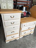 Front view of tall chest and low dresser