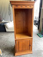 Full view of tall plywood shelf with cabinet