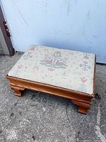 Top view showing entire footstool and needlepoint pattern