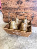 Wooden caddy with four pears front view