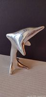 Full view of Hoselton aluminum dolphin sculpture