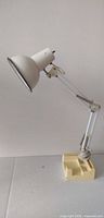 Lamp fully extended showing articulating arm and base