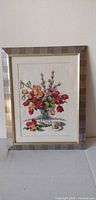 Full view of framed floral needlework artwork