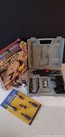 Overall lot showing rotary tool kit in case, retail box, shaping set blister pack, loose grinding stones