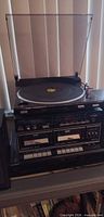 Stereo system showing turntable, tuner, cassette deck