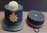 Shako and pillbox caps side by side