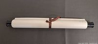 Scroll rolled and tied with ribbon