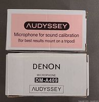 Audyssey and Denon microphone boxes showing model labels