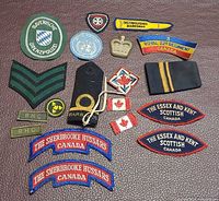 All 18 embroidered patches laid out on surface