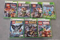 All seven Xbox 360 game cases front view