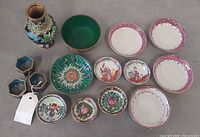 All thirteen pieces displayed