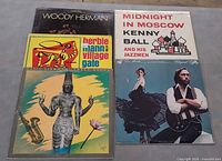 Five album covers laid out together