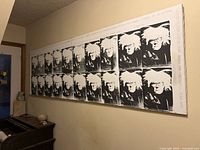 Full view of two-panel Andy Warhol portrait print mounted on wall