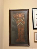 Full view of framed brass rubbing depicting medieval figure