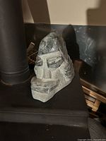 Front perspective of the carved soapstone face sculpture showing full facial detail