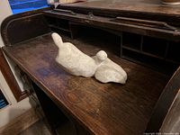 Overall view of abstract alabaster sculpture on desk