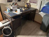 Overall view of vintage wood desk showing drawers and top surface
