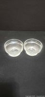 Two clear glass bowls side by side