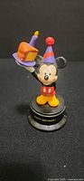 Front view of Mickey Mouse figurine on base