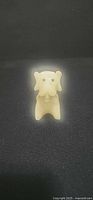 Front view of cream alabaster dog figurine