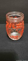 Full view of jar showing peanut embossing and red enamel