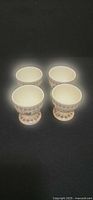 Front angled view showing all four egg cups and pattern