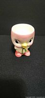 Front view of chick-shaped egg cup