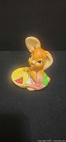 Front view of ceramic bunny holding pie