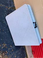 two tables folded, showing carry handles