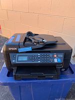 Front view of Epson WF-2650 printer showing control panel and overall condition