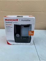 Front of boxed Honeywell warm mist humidifier