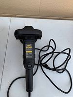 Full view of Meguiar's MT300 polisher with cord coiled