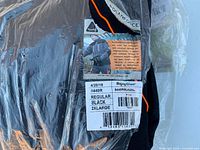 Close-up of factory label showing brand, model 8440R, size 2XL, color black
