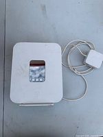 Front view of T-Mobile gateway and attached power cord