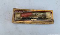 Boxed Life-Like HO locomotive front view showing model and torn cellophane