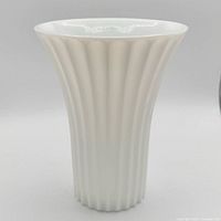 Full view of white fluted milk glass vase