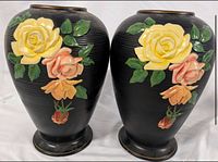 Front view of both vases showing floral relief