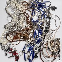 Pile view showing necklaces, bangles, earrings, bead strands