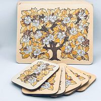 Front view of all placemats and coasters showing magnolia design