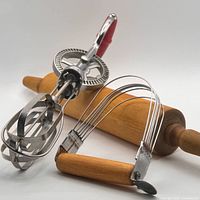 Rotary beater, pastry blender and rolling pin grouped