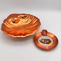 Top view of copper shell dish and souvenir ashtray