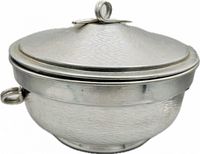 Side view of hammered silver-tone ice bucket with lid and ring handles