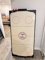 Front view of Cooper air hockey table vertical